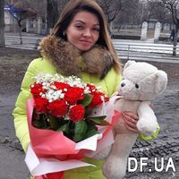 Bouquet of red roses and baby's breath in the shape of a heart