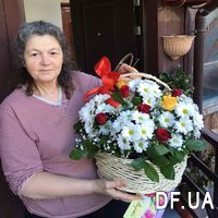 Basket of red and yellow roses and white chrysanthemums