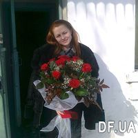 Round bouquet of red roses and gypsophila