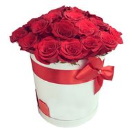 Scarlet roses in a round box