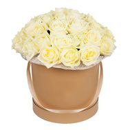 White roses in a round box