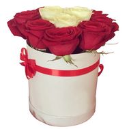Red and white roses in a round box