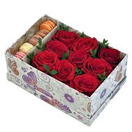 Macaroons and roses in a box