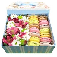 Macaroons in a box of flowers to buy