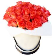 Orange roses in a round box