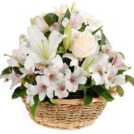 Flower arrangement in a basket of fresh flowers