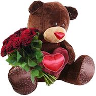Big teddy bear and bouquet of roses