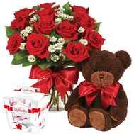 Teddy bear with flowers and sweets