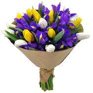 Blue irises, white and yellow tulips in a bouquet