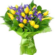 Yellow tulips with blue irises in a bouquet
