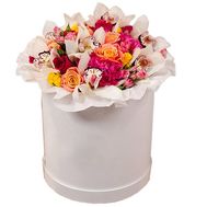 A bouquet of flowers in a hat box