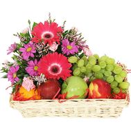 Arrangement of flowers and fruits in a basket