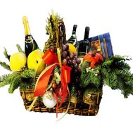Basket:fruit, champagne, sweets