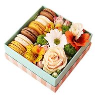 Box of flowers and macaroons