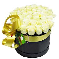White roses in a black box