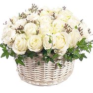 Basket of white roses with verdure