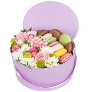 Macaroons and flowers in a box