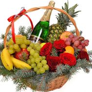Champagne and fruits in the basket for the New Year