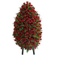 Funeral wreath of red roses with greenery