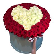 Heart of red and white roses in a box