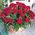 Red roses in a man's basket for an anniversary - view 1