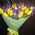 Yellow tulips with blue irises in a bouquet - view 2