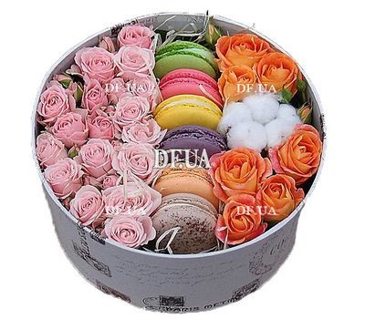 Flowers and macaroons in a box