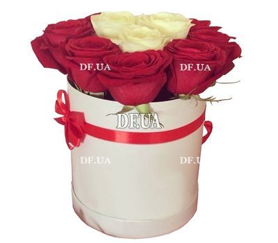Red and white roses in a round box