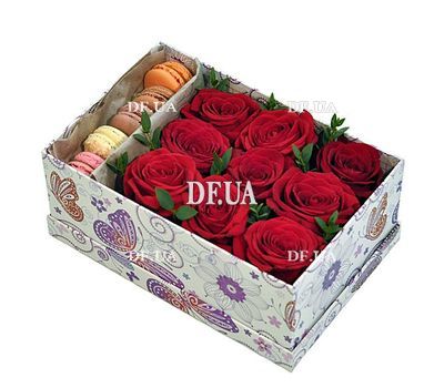 Macaroons and roses in a box