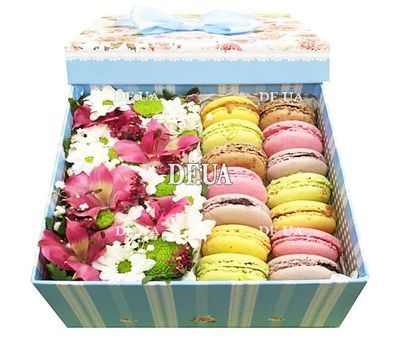 Macaroons in a box of flowers to buy