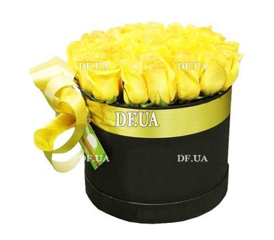 Yellow roses in a round box