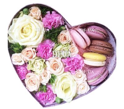 Flowers and macaroons in a box
