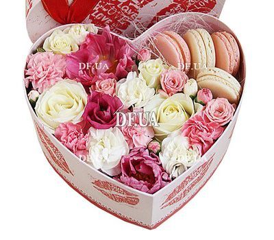 Flowers and macaroons in a box to buy