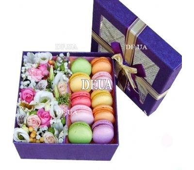 Gift box of macaroons and flowers