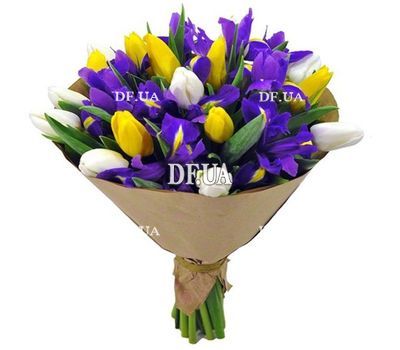 Blue irises, white and yellow tulips in a bouquet