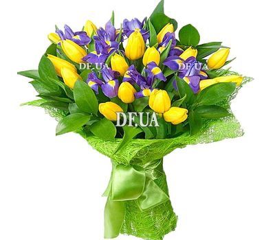 Yellow tulips with blue irises in a bouquet