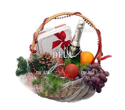 Fruit basket with champagne and sweets