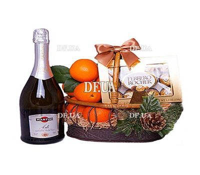 Champagne, tangerines and sweets in the basket
