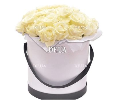Composition of white roses in a box