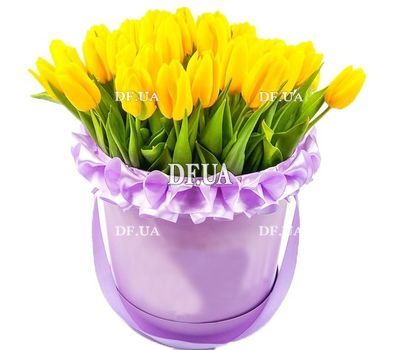 Yellow tulips in a round box