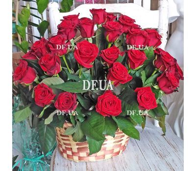 Red roses in a man's basket for an anniversary - view 1