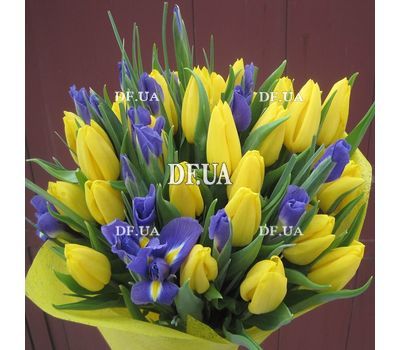Yellow tulips with blue irises in a bouquet - view 1