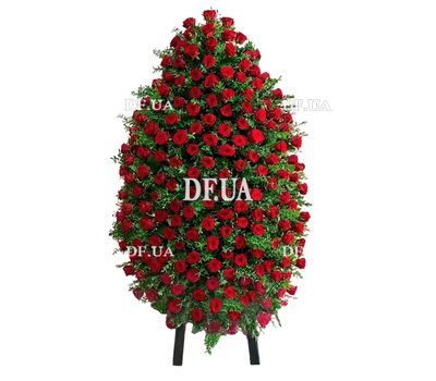 Funeral wreath of red roses with greenery