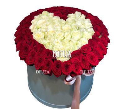 Heart of red and white roses in a box